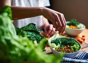 Woman preparing healthy lunch in kitchen