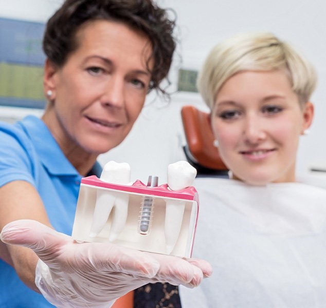 Dentist discussing dental implant with patient