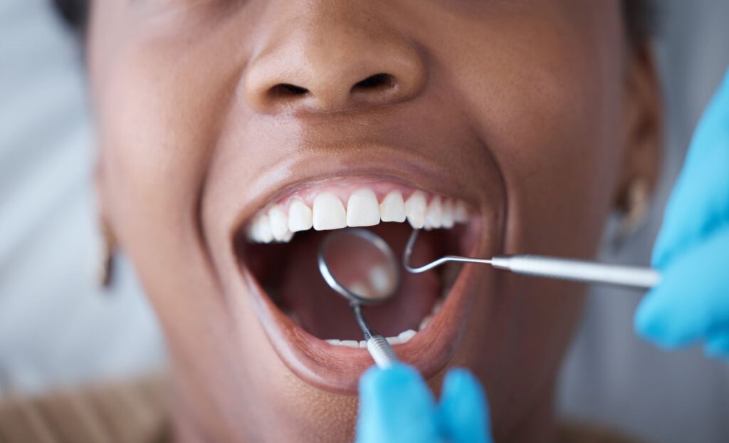 A woman having her teeth cleaned at the dentist