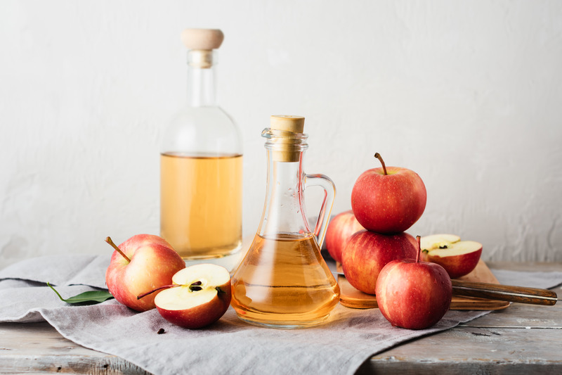 A pitcher of apple cider vinegar